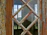 Close-up of a pristine diamond white UPVC window profile glowing under Himalayan sunlight.