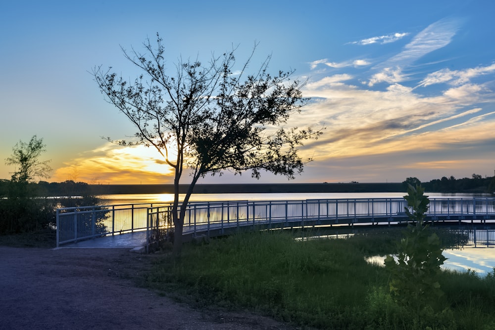 the sun is setting over a body of water