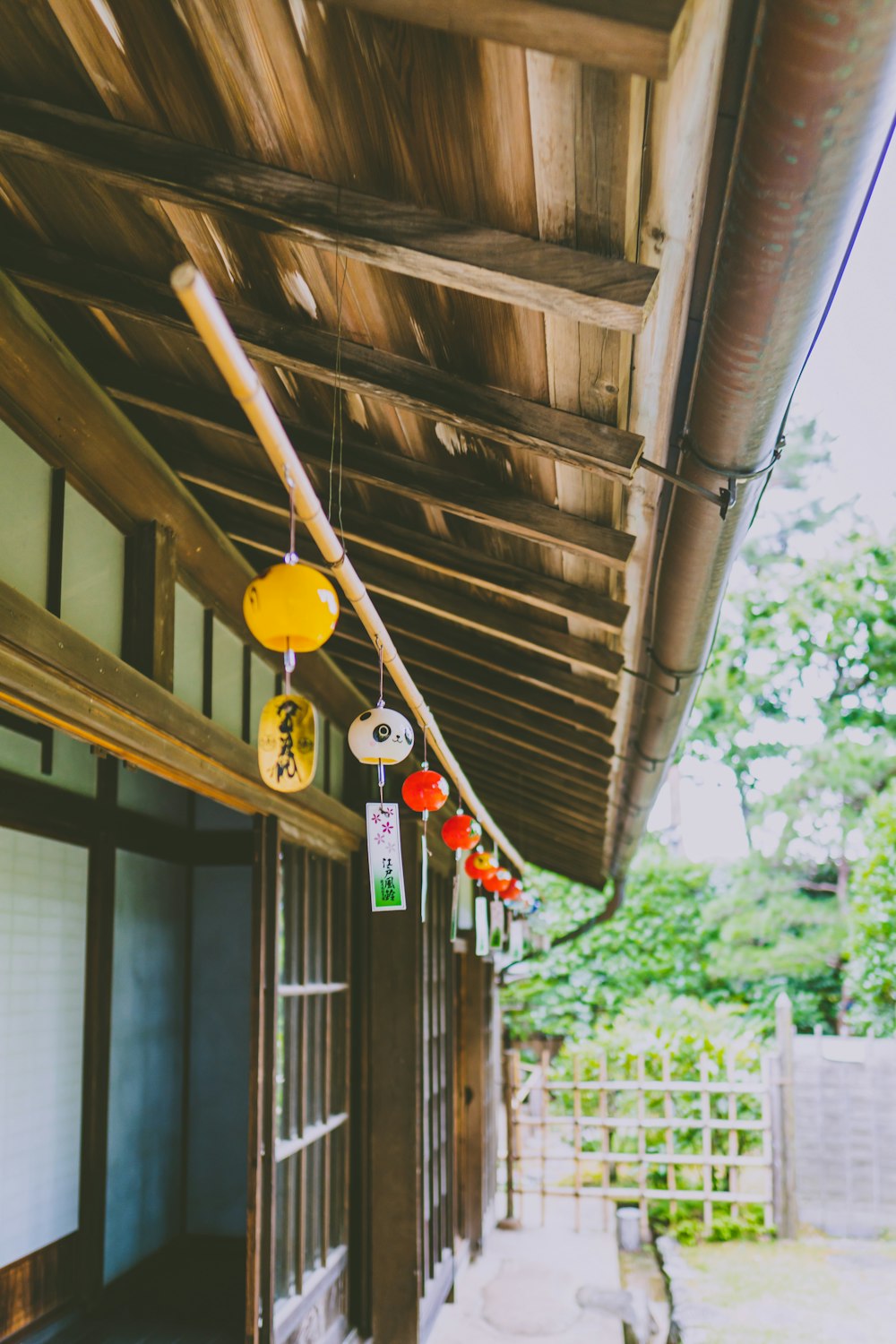 a building with a bunch of decorations hanging from it's roof