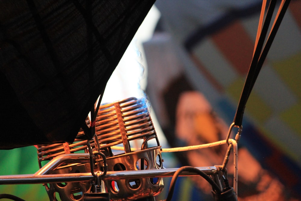 a close up of an umbrella with a person in the background