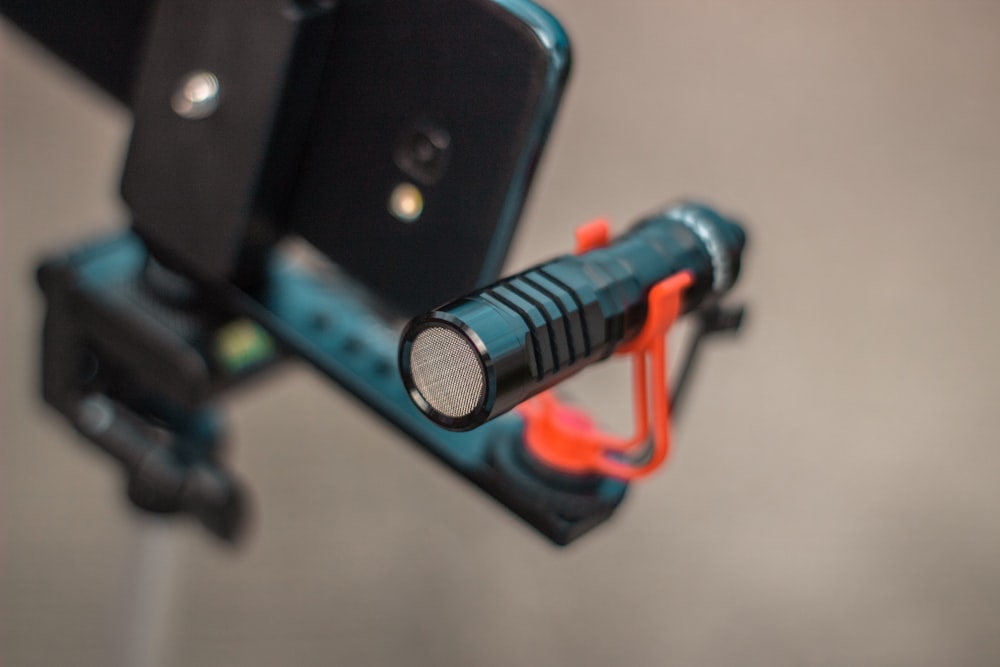 a close up of a cell phone on a tripod