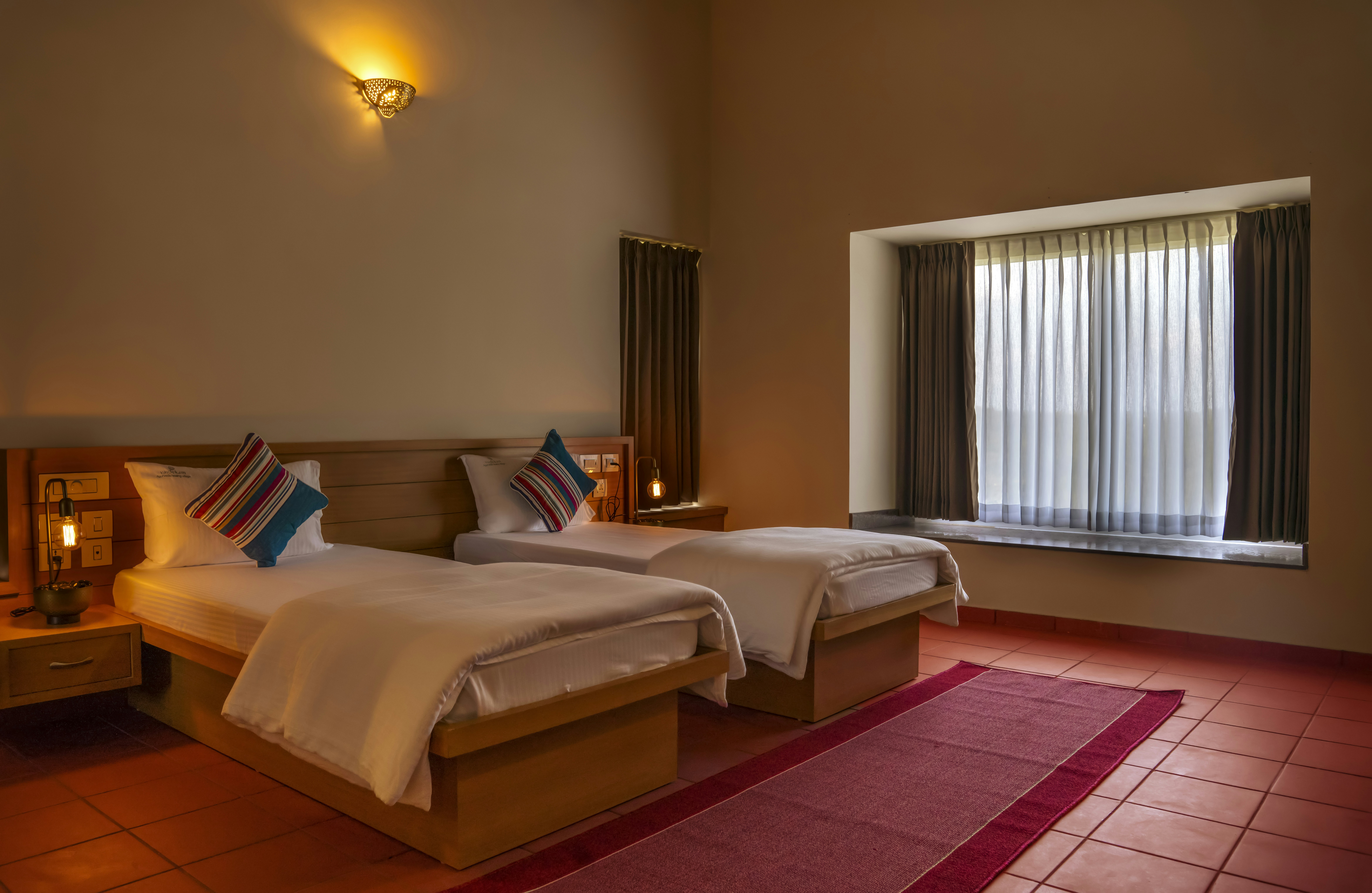 a couple of beds sitting in a bedroom next to a window, arcitecture,interior designer,interior photography,interior photograph,photo editing