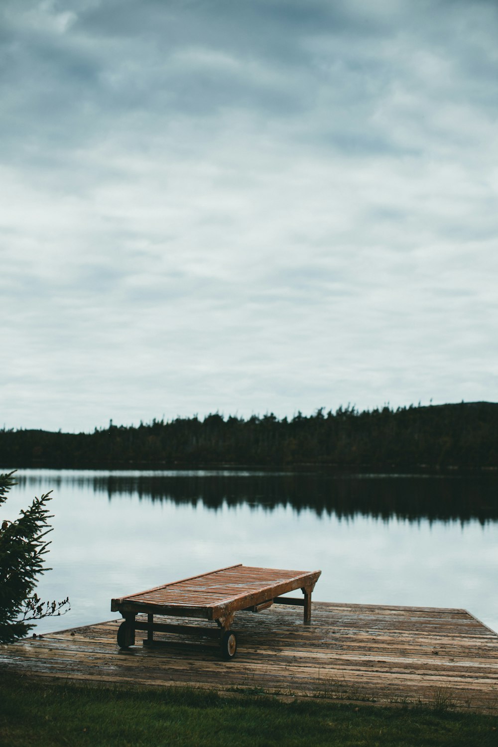 a wooden dock sitting on top of a lake