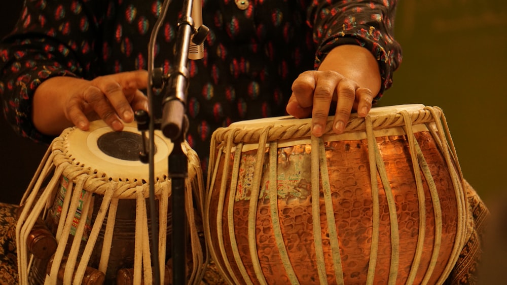 a close up of a person playing a musical instrument