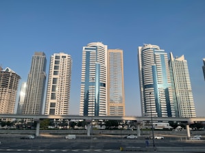 a group of tall buildings sitting next to each other