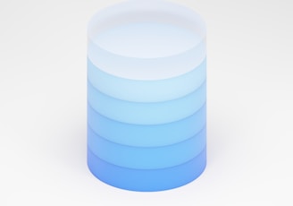 a stack of stacked blue and white plates