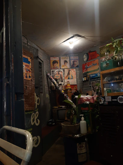 A vibrant retro neon-lit room filled with 90s memorabilia, VHS tapes, and vintage gaming consoles.