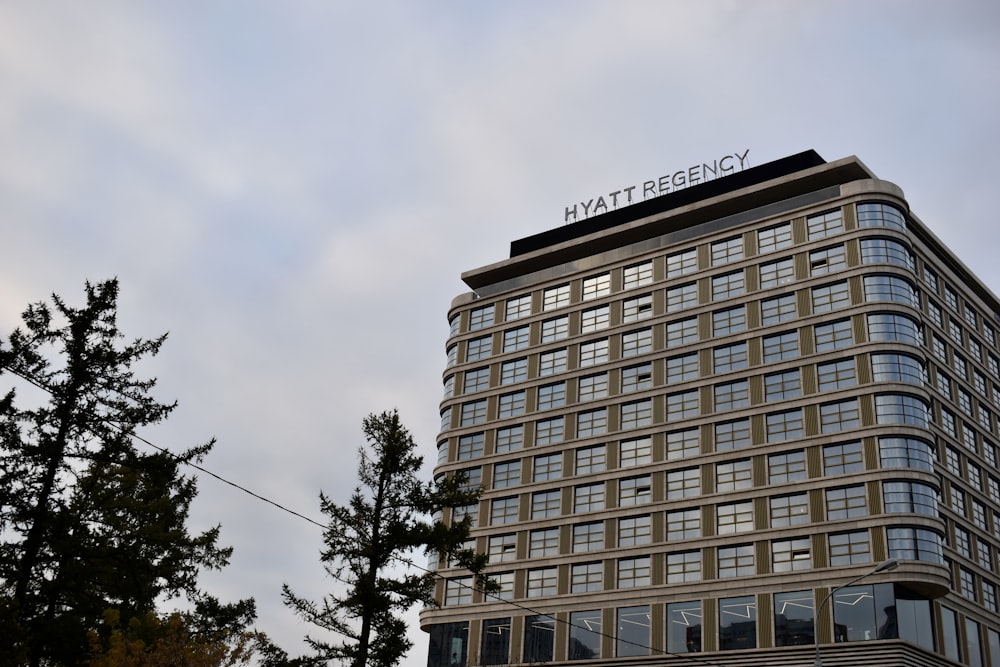 a tall building with a sign on top of it