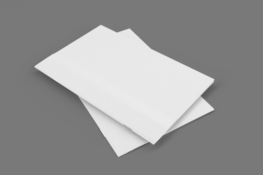 a stack of white paper on a gray background