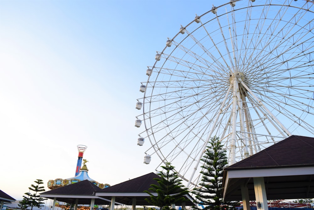 a large ferris wheel sitting next to a building