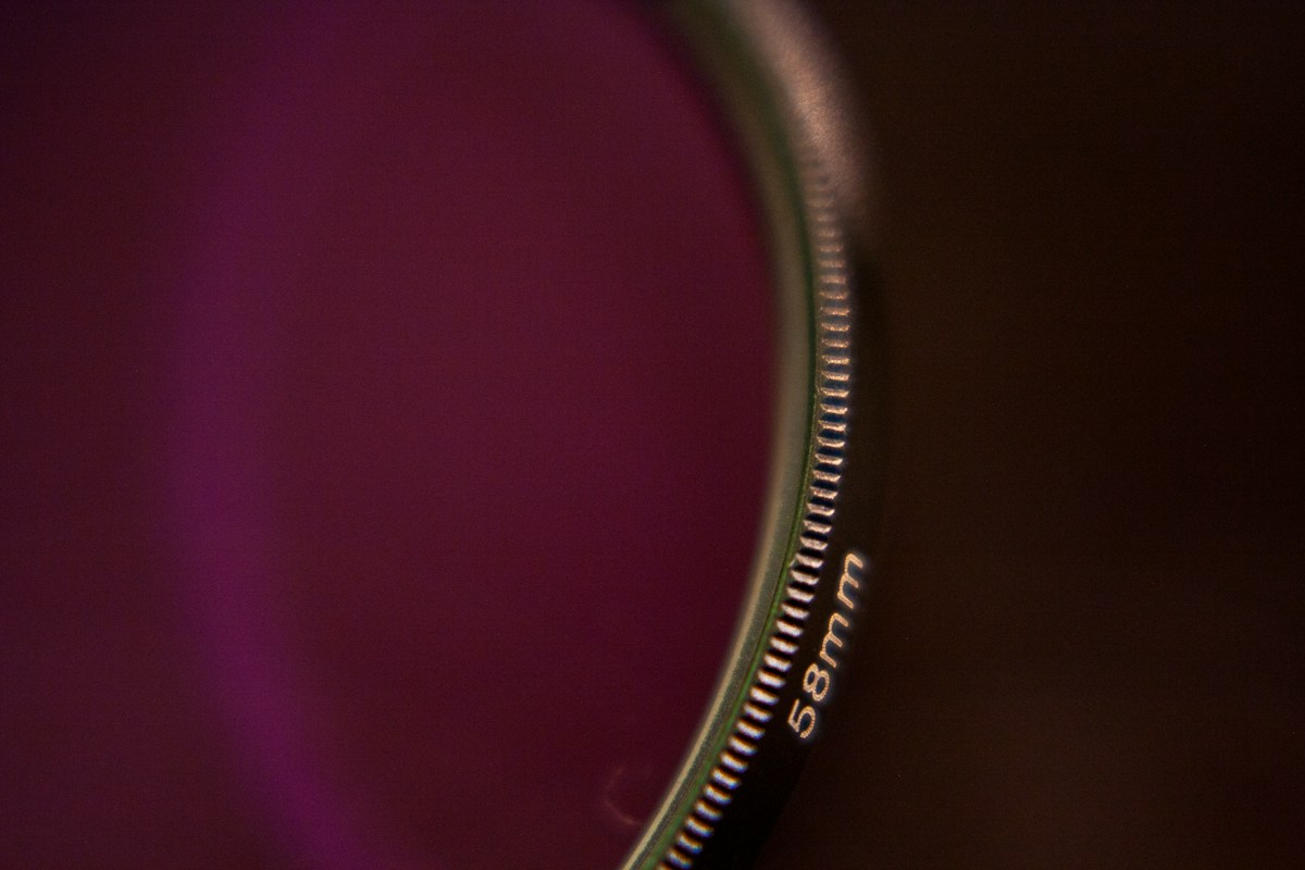 Close-up of a camera lens with a blurred background, symbolizing focus on creative ways to thank your volunteers.