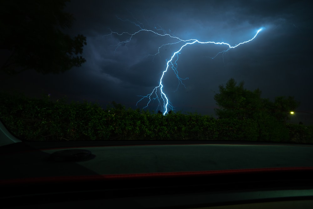 a lightning bolt is seen in the night sky