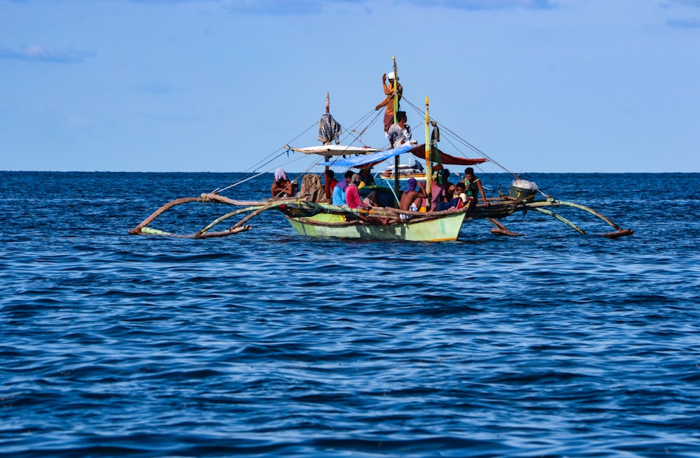 a group of people riding on the back of a boat