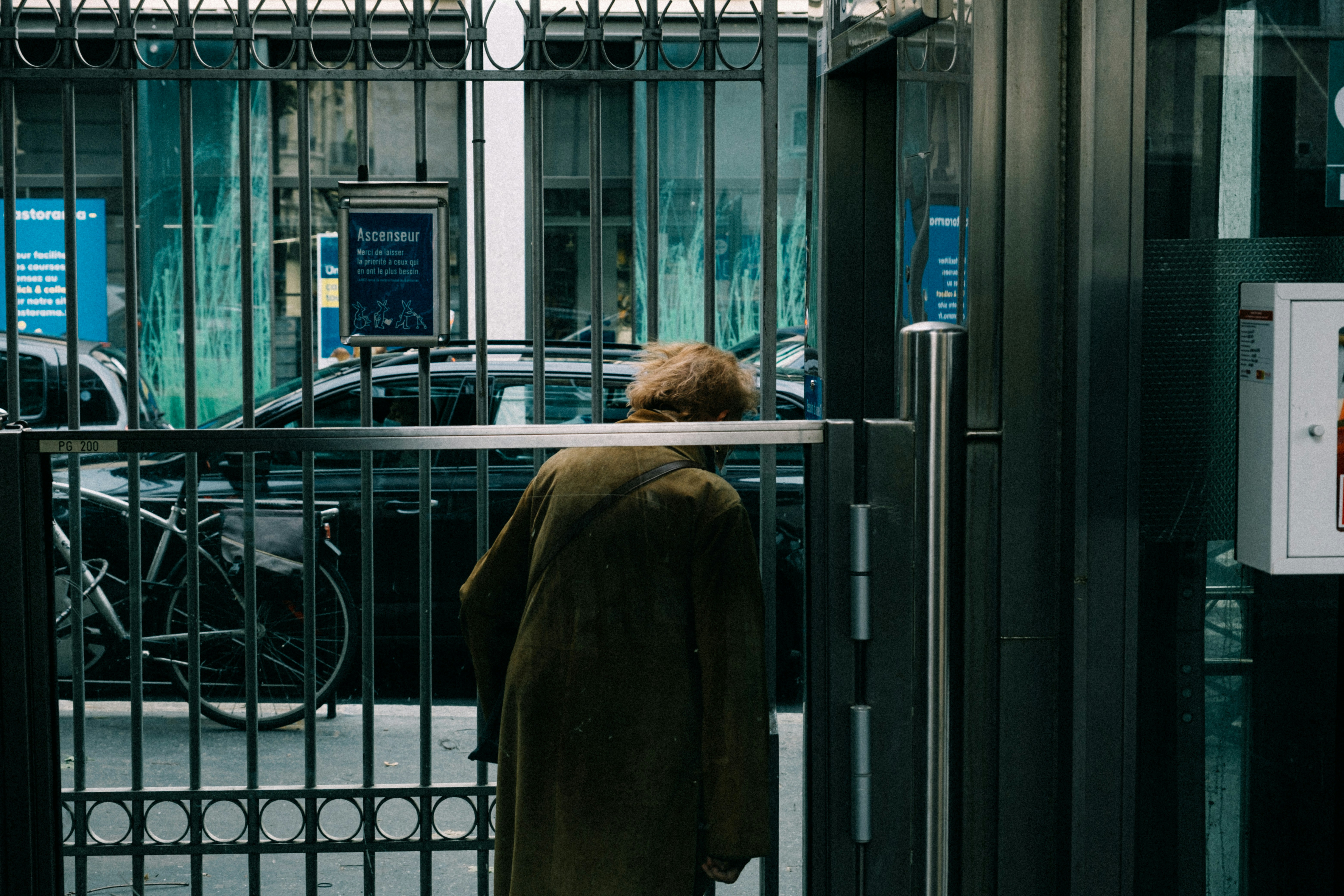 a person standing in front of a gate