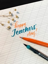 A cheerful teacher handing a customized notebook to a smiling student in a bright classroom.