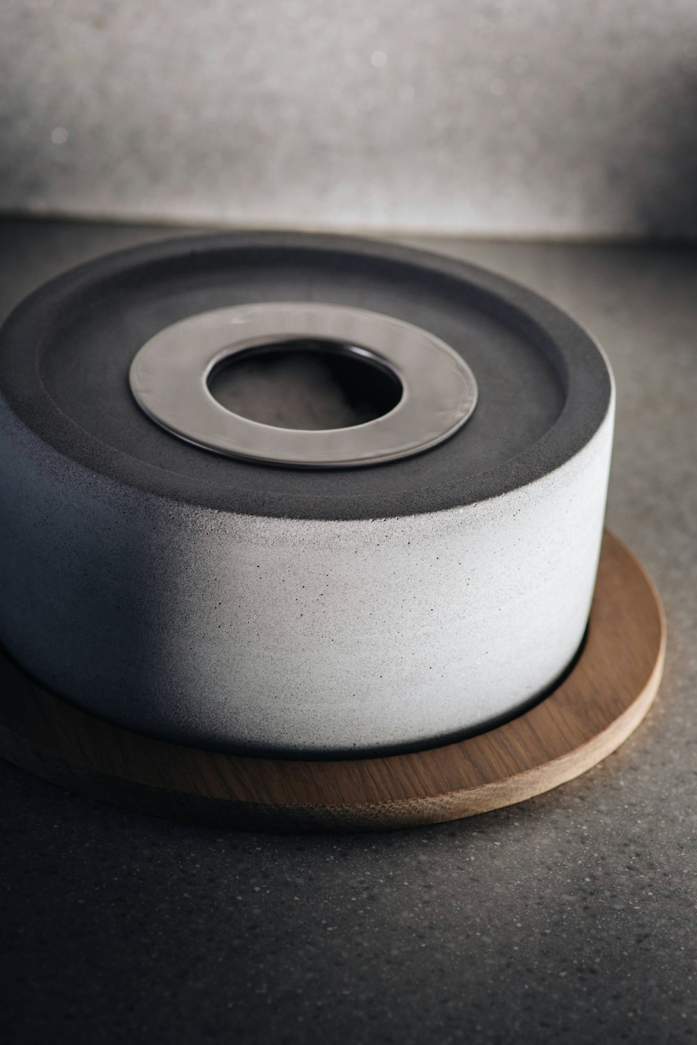 a close up of a white and black ribbon on a wooden stand