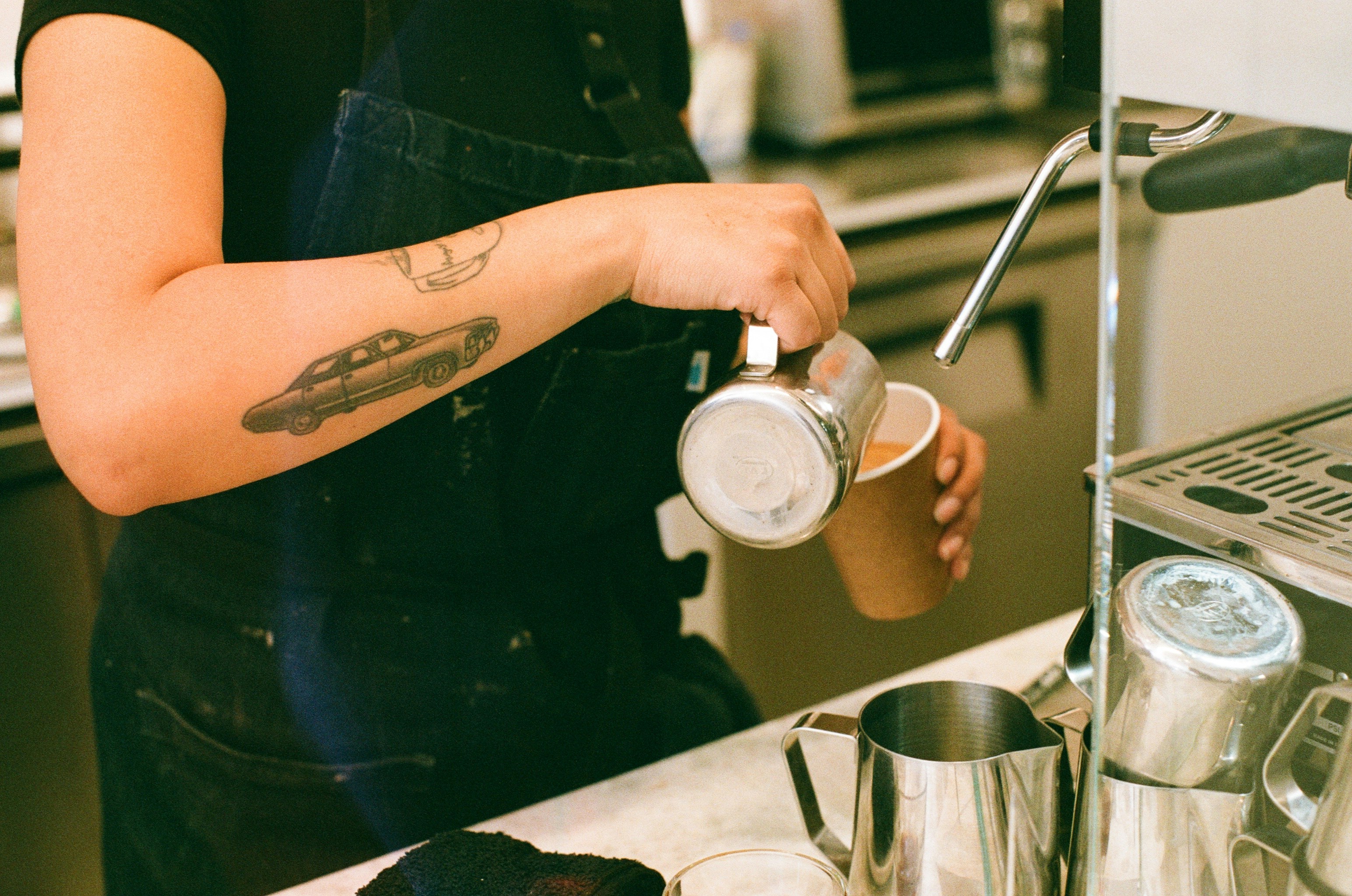 Barista pouring coffee