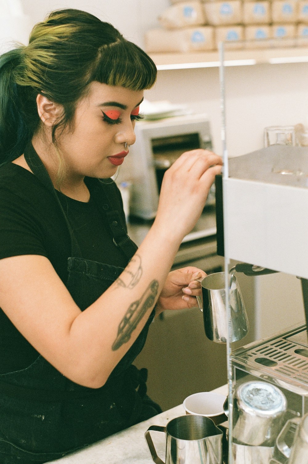 a woman with green hair is making something