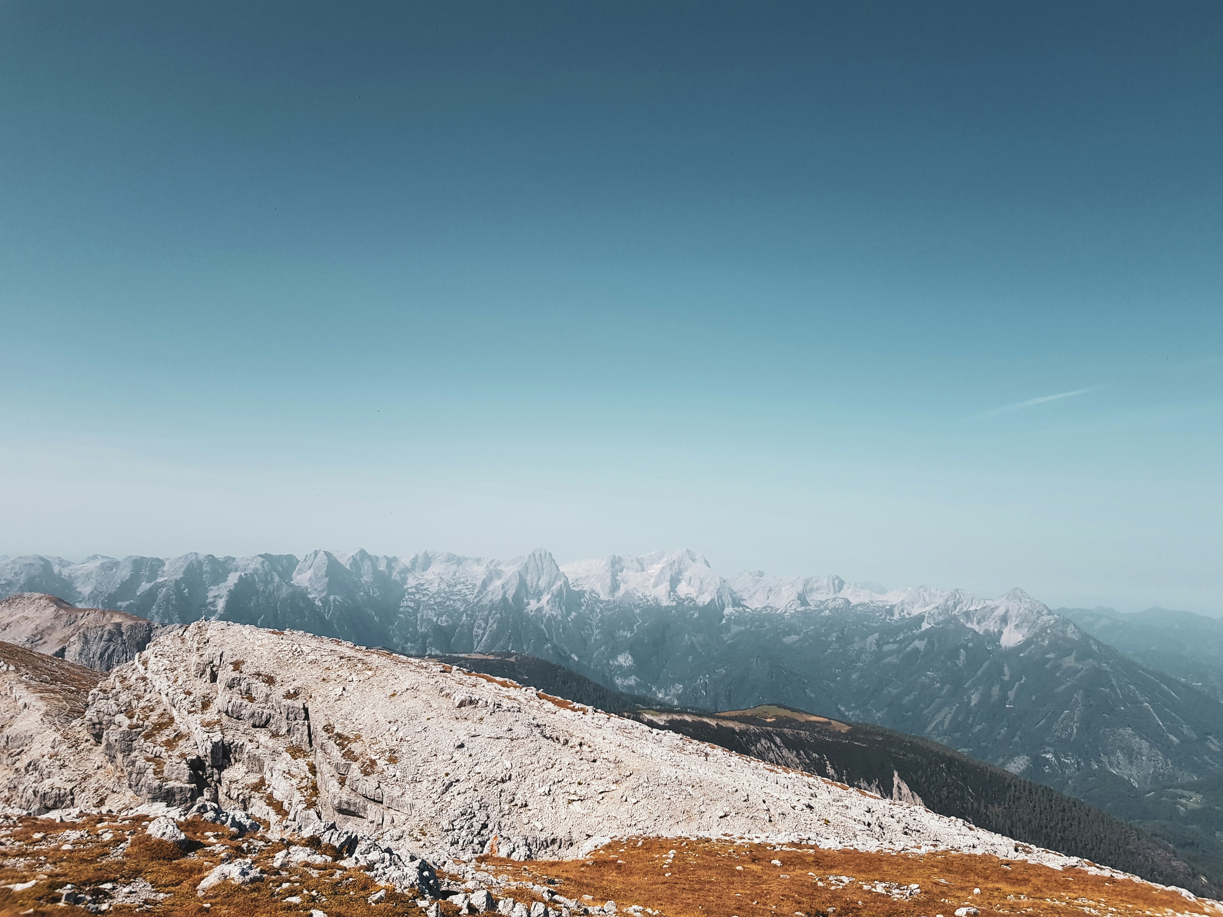a person standing on top of a snow covered mountain
