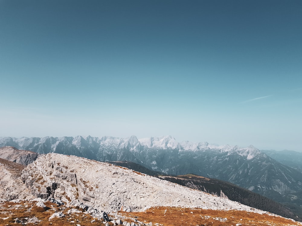 a person standing on top of a snow covered mountain