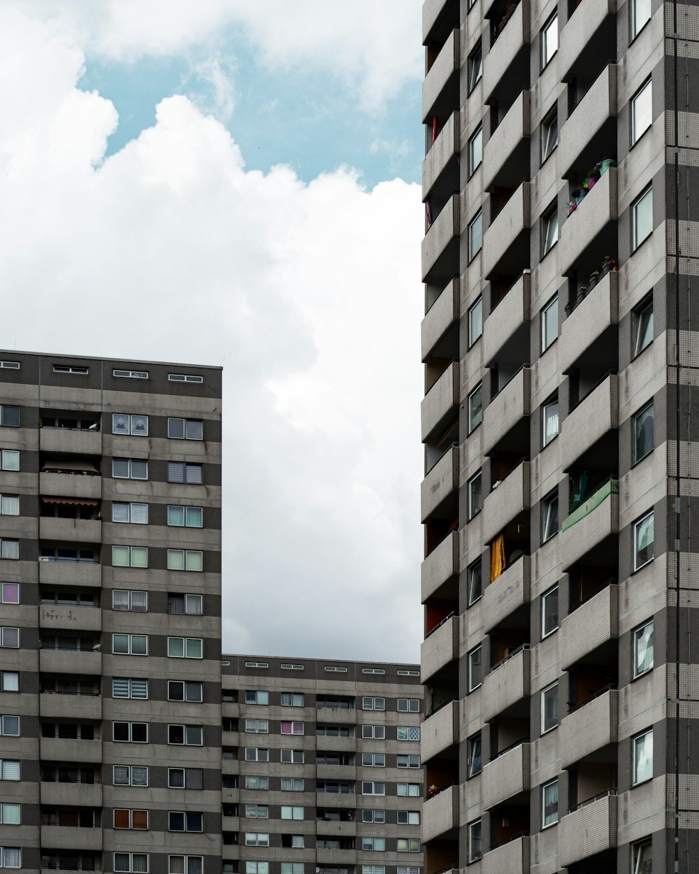 a couple of tall buildings sitting next to each other