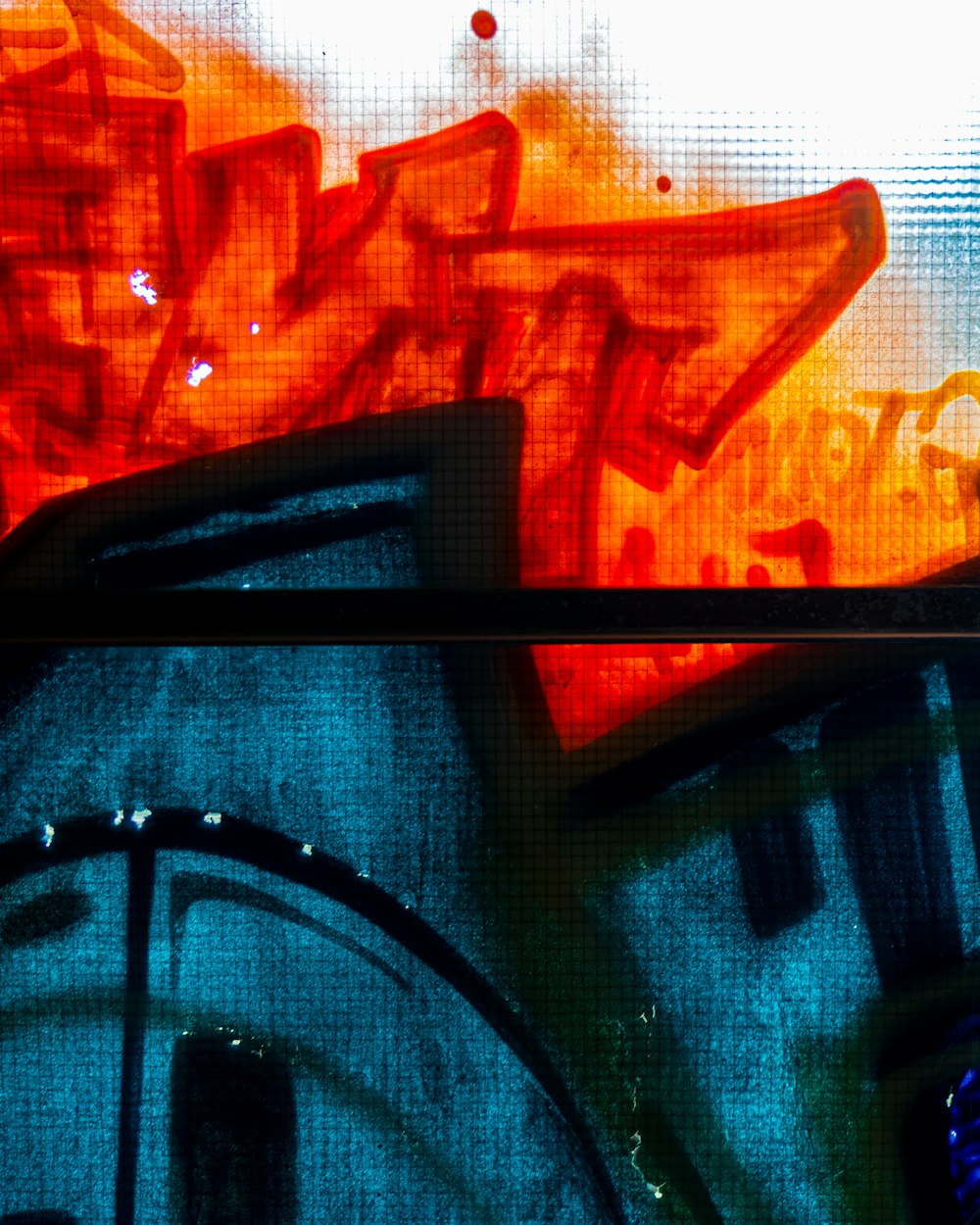 a close up of a wall with graffiti on it