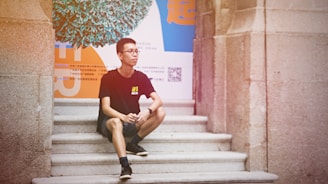 A person wearing a unique t-shirt with a QR code while smiling.