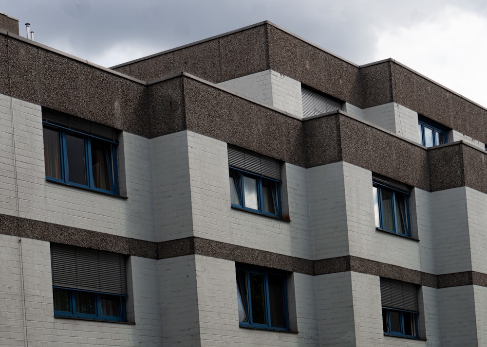 a building with windows and a clock on the side of it