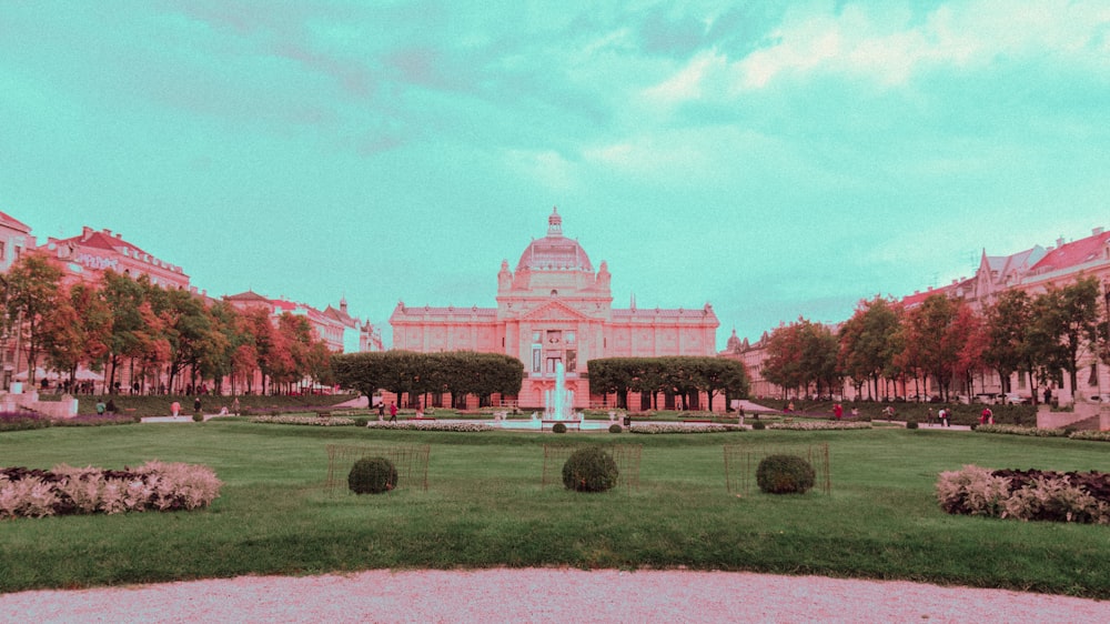 a large building with a fountain in front of it