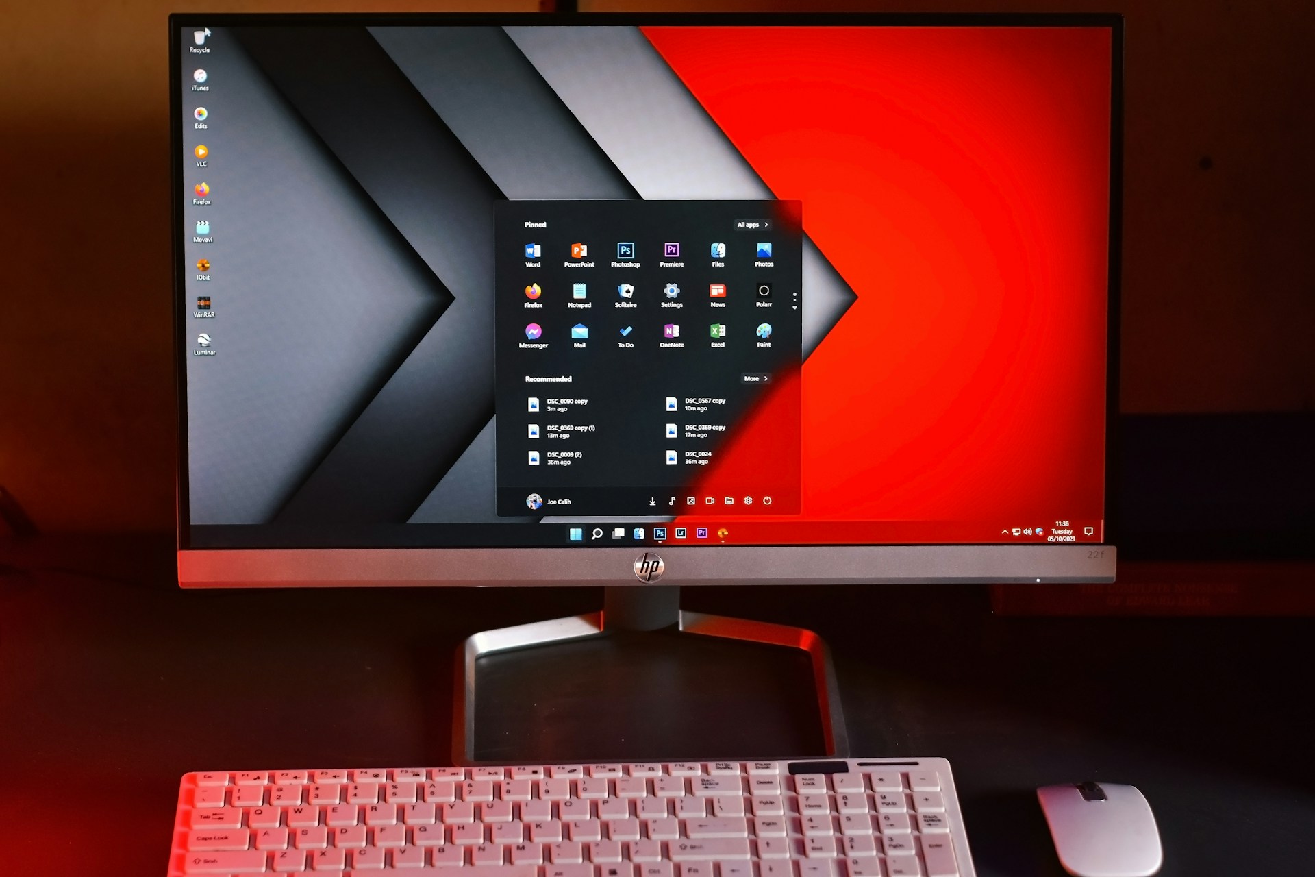 a computer monitor and keyboard on a desk