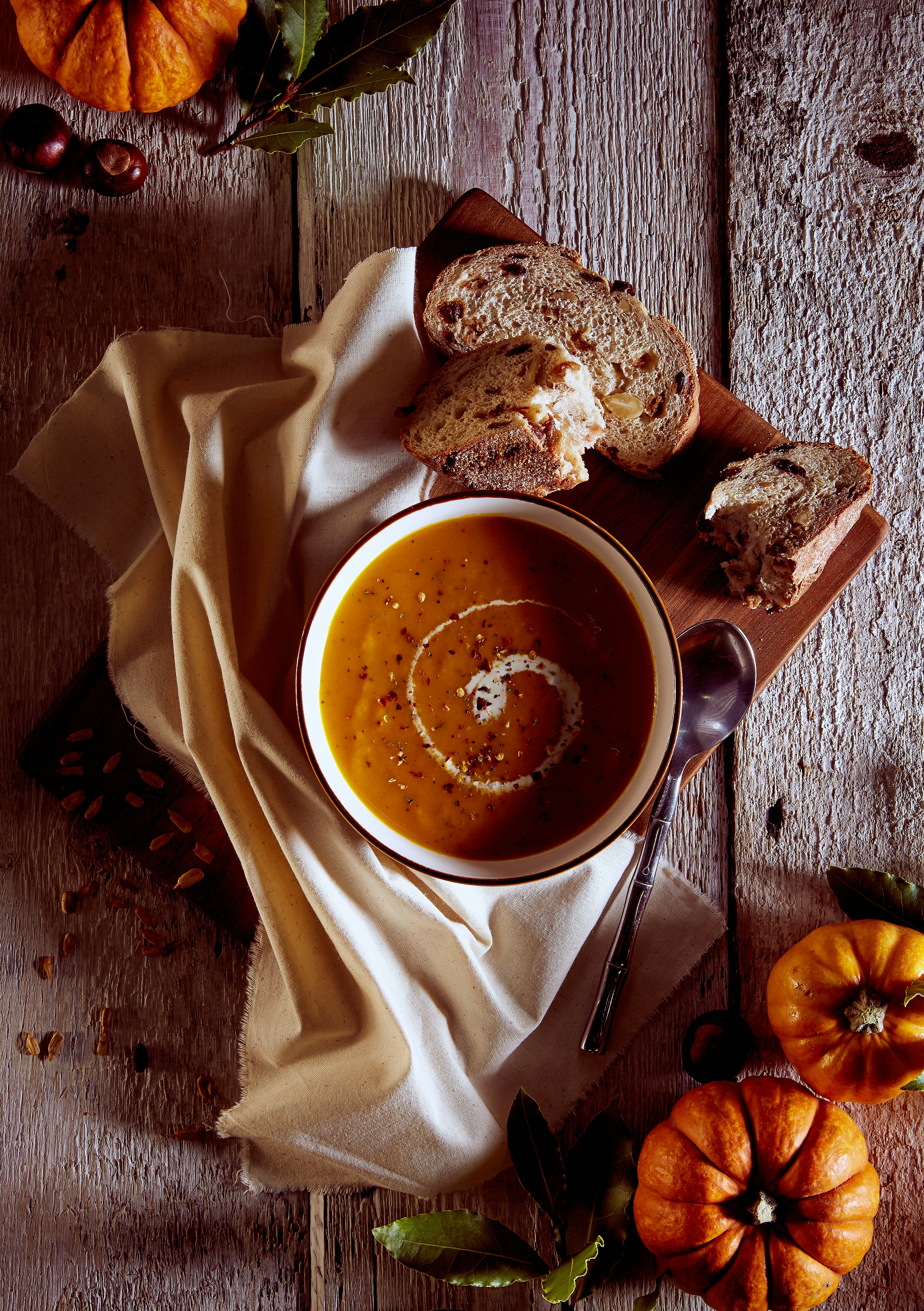 a bowl of soup on a wooden table