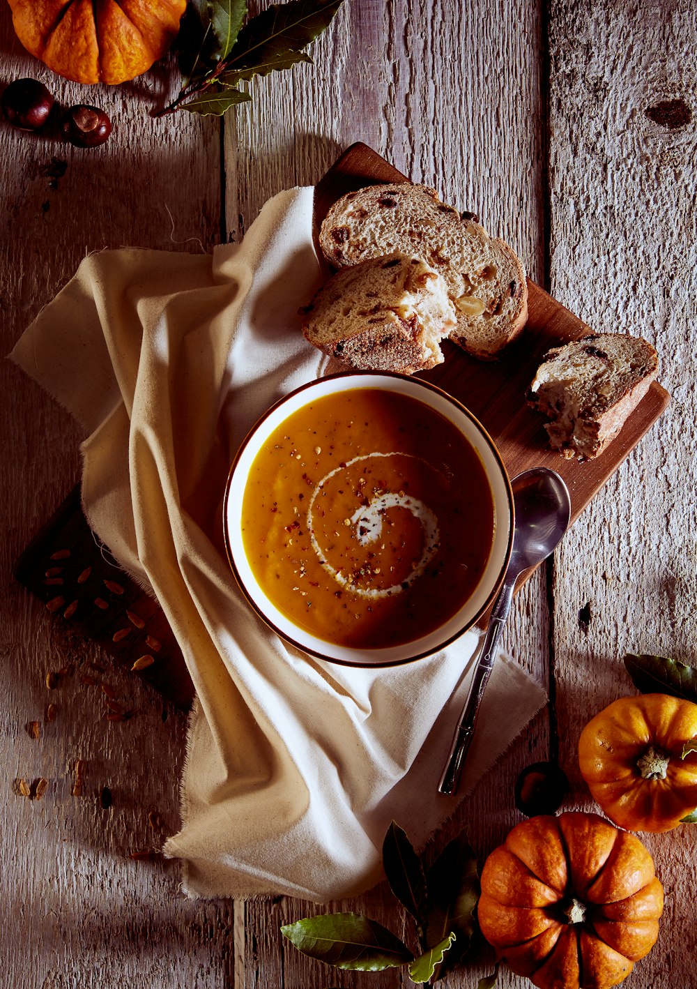 a bowl of soup on a wooden table