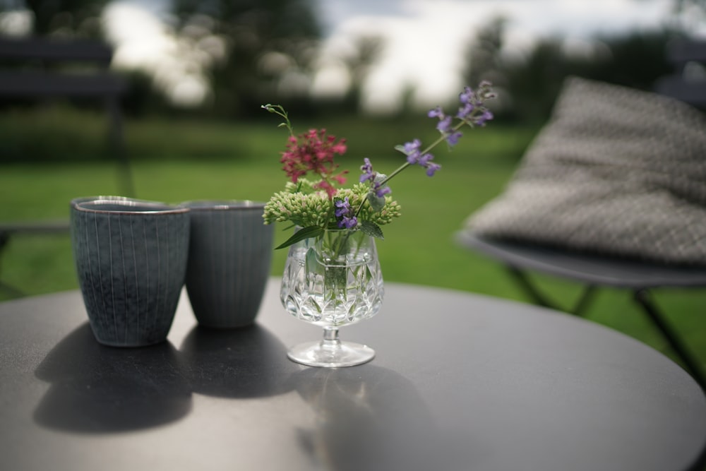 a couple of vases sitting on top of a table