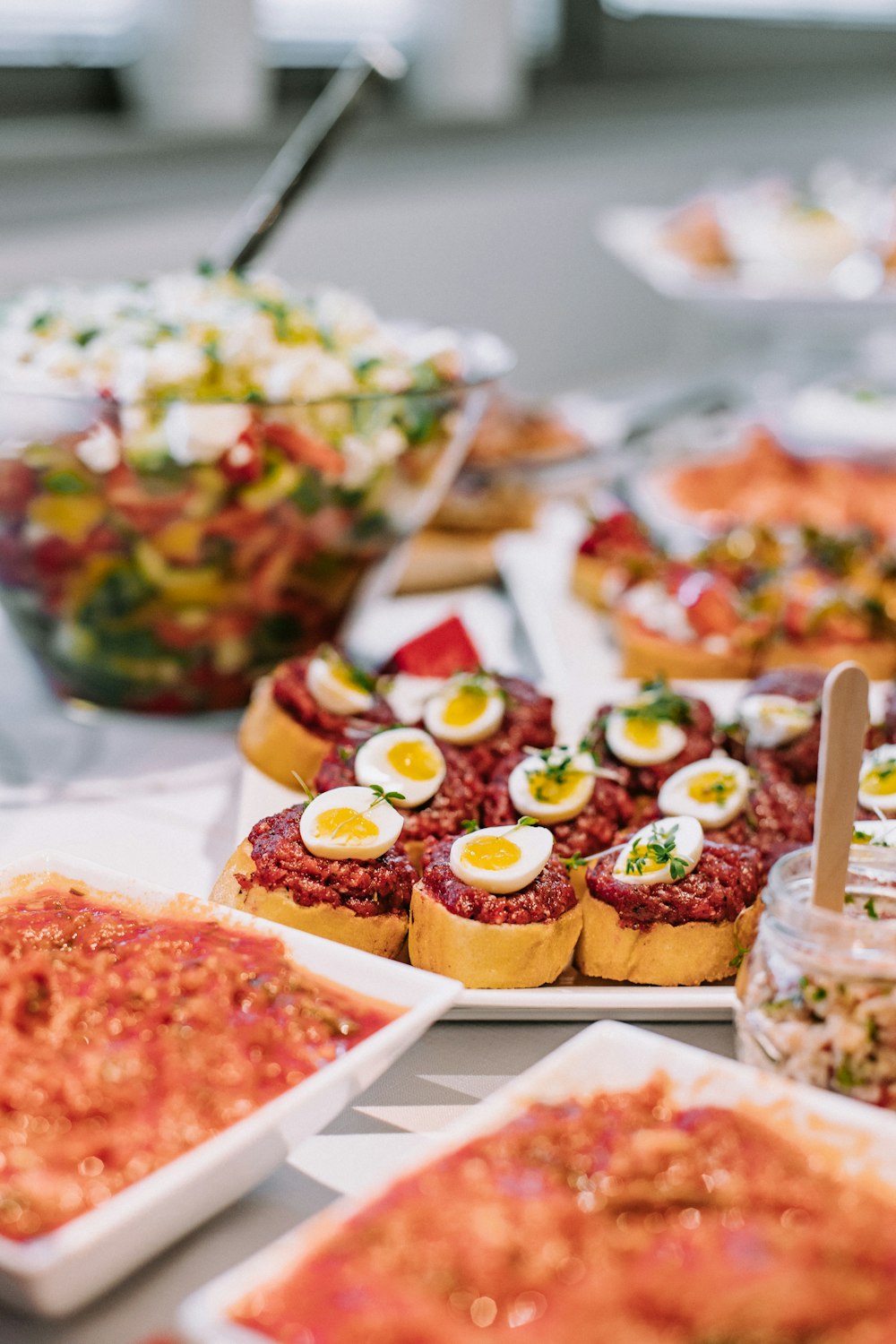 a table topped with lots of food covered in toppings