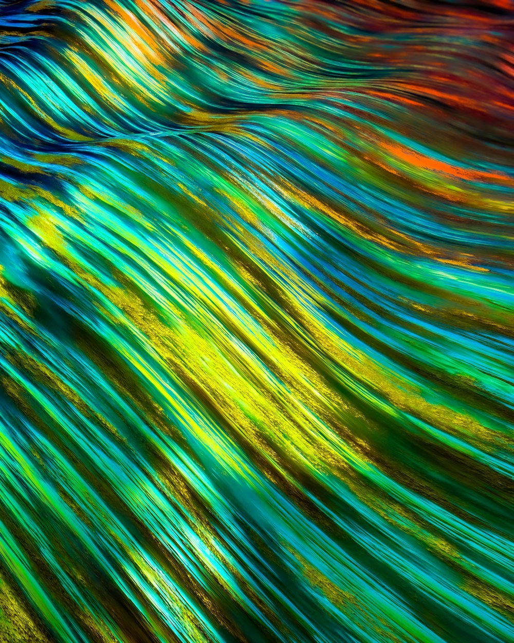 a close up view of a multicolored wave
