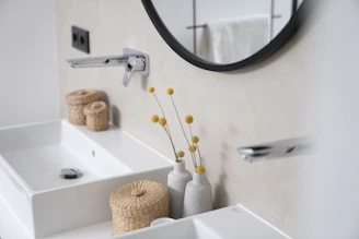 a bathroom with two sinks and a mirror