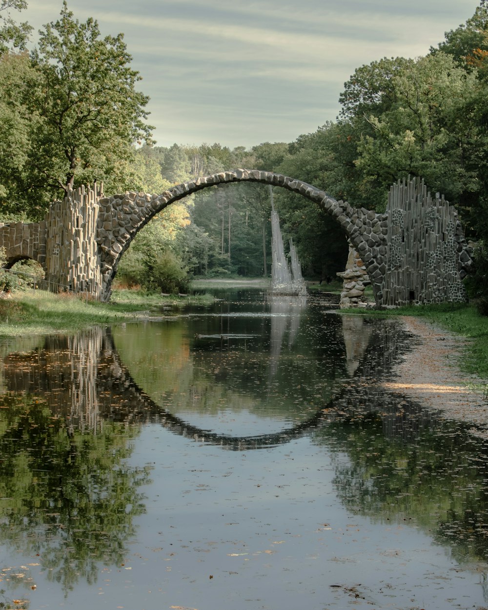 a stone bridge over a body of water