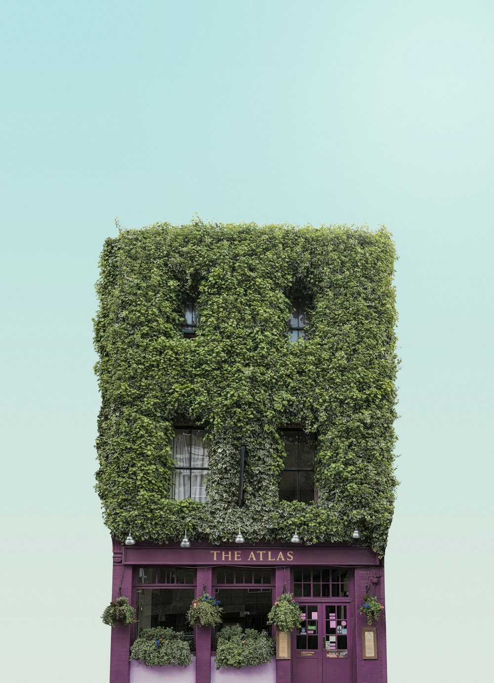 a tall building covered in vines and plants
