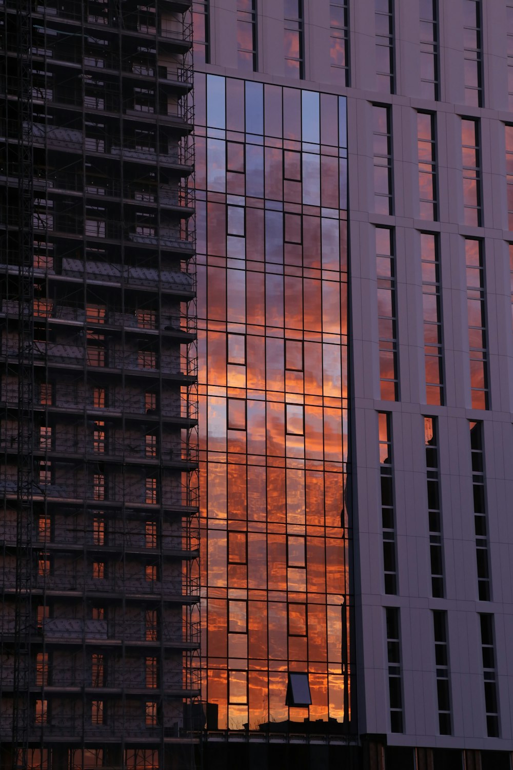 a very tall building next to a very tall building