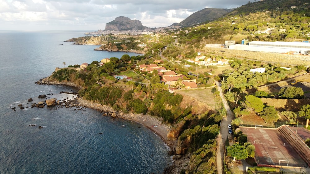 an aerial view of a small town by the ocean