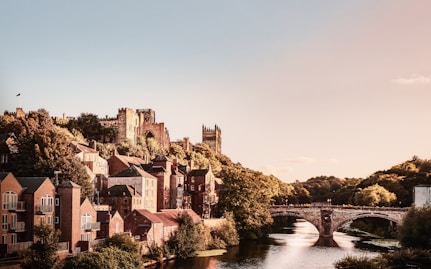 a river running through a city next to a bridge