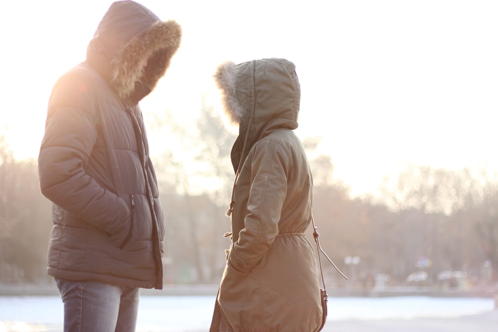 a couple of people standing next to each other