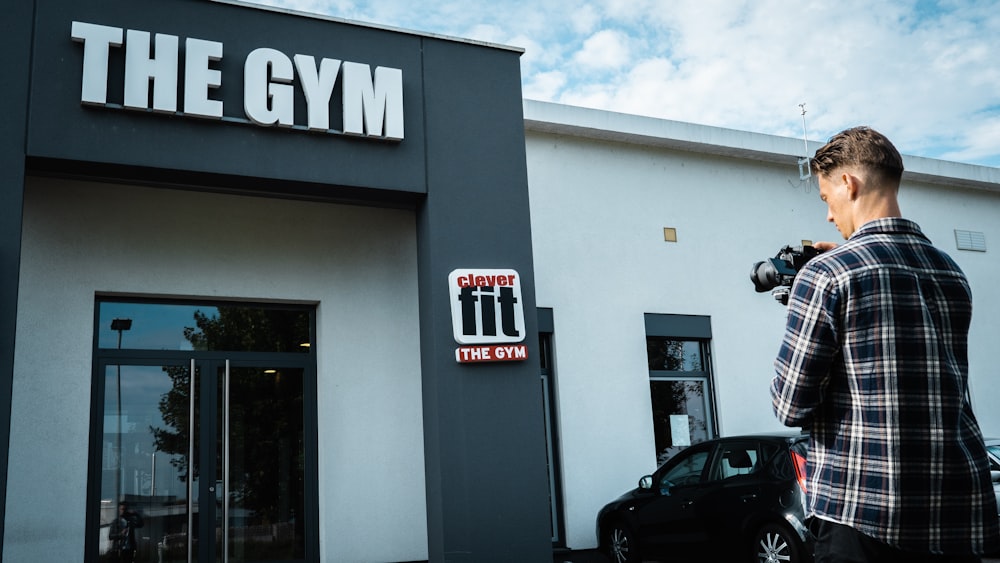 a man standing in front of a gym