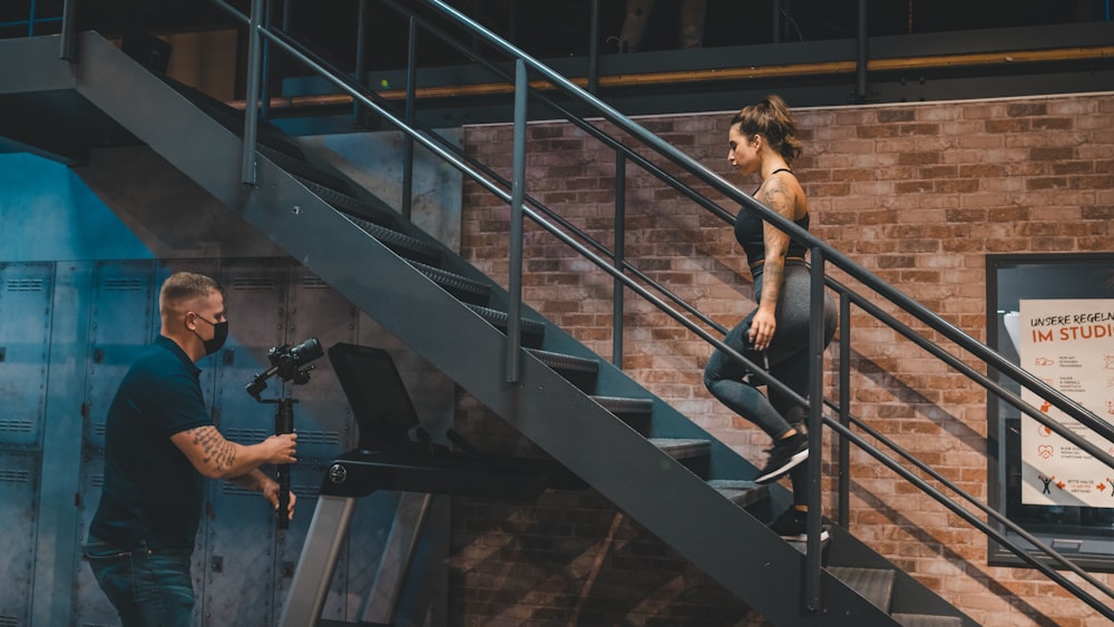 a man and a woman on a set of stairs