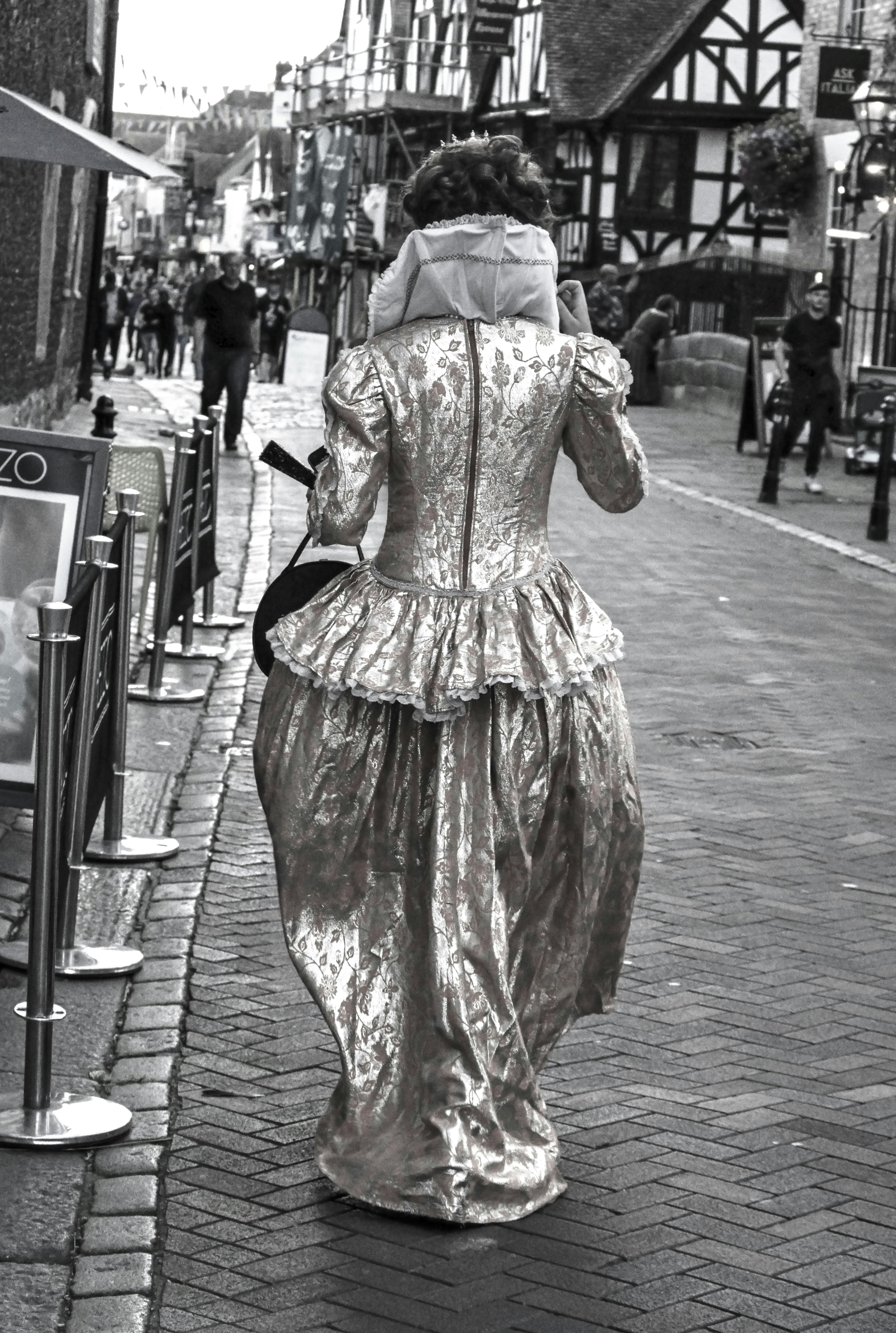 A woman is walking down the street in a dress photo – Free Human Image ...