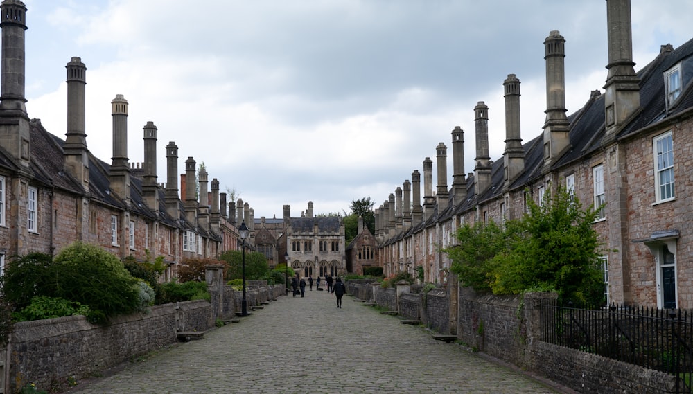 a cobblestone street lined with stone buildings