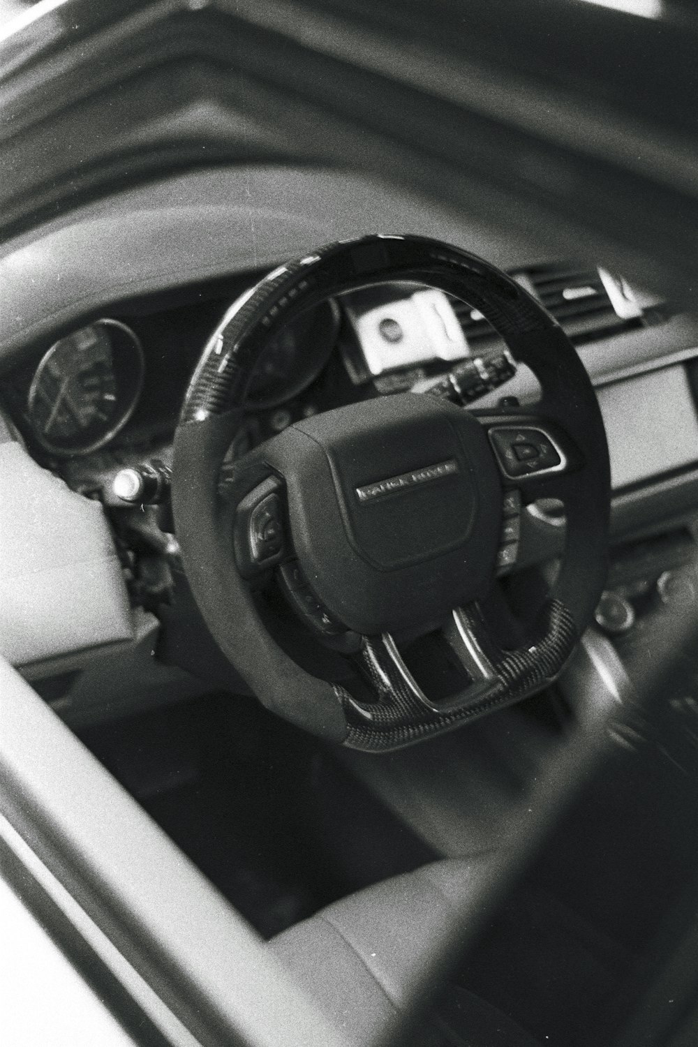 a black and white photo of a car dashboard