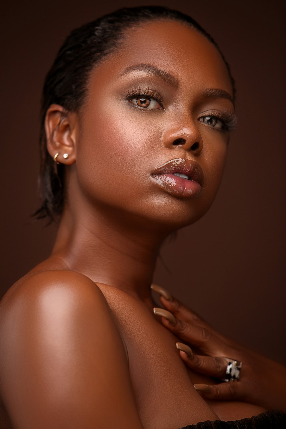 a woman in a black dress posing for a picture