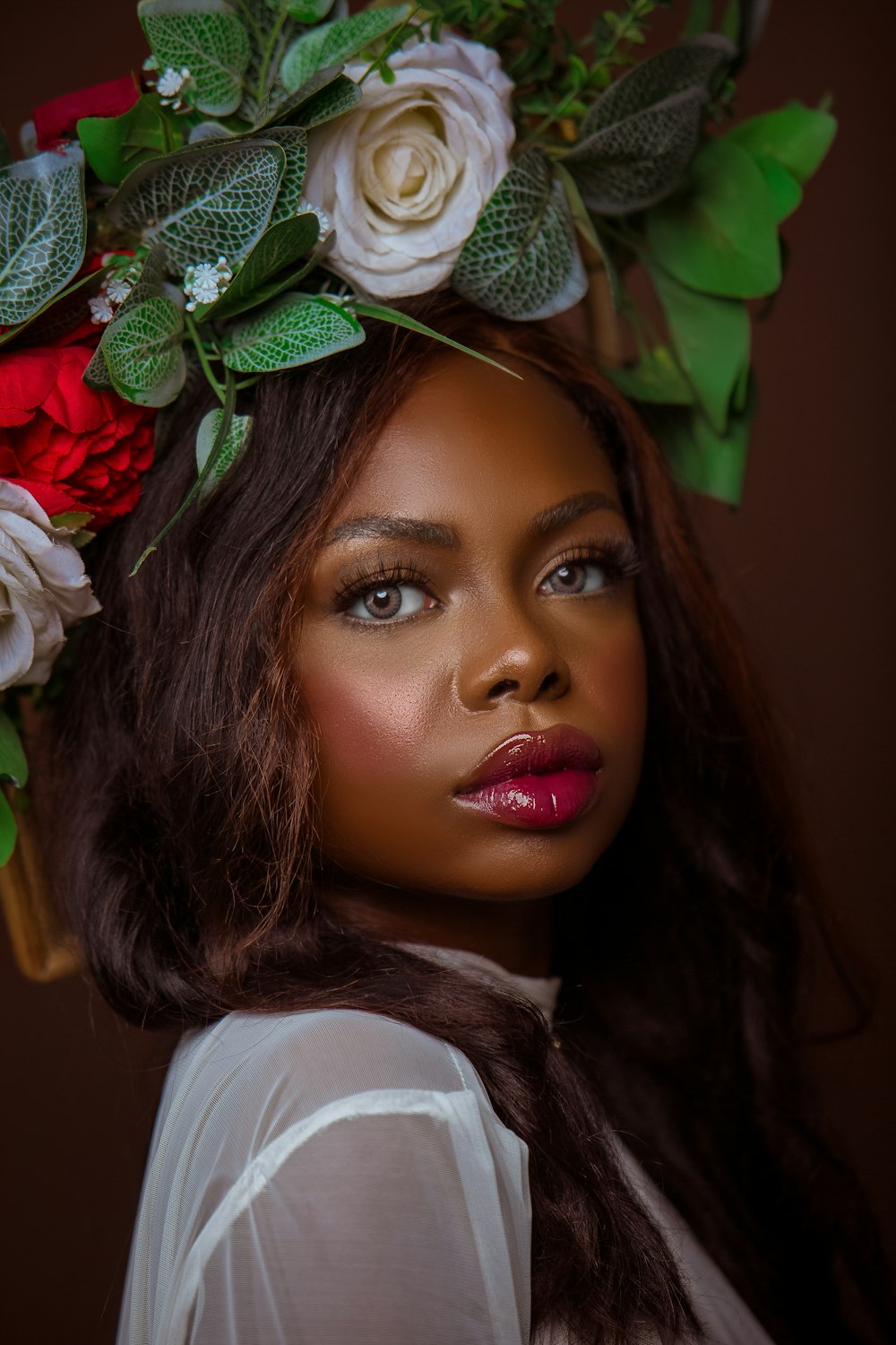 a woman with a flower crown on her head