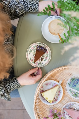 A happy customer enjoying a slice of sugar-free cake at alumonk tea shop.